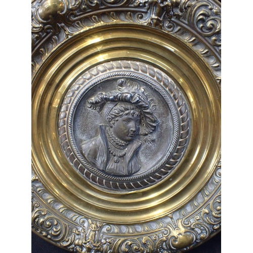 32 - A PAIR OF 19TH CENTURY RENAISSANCE REVIVAL PLAQUES the cast metal portrait centres in repousse brass... 