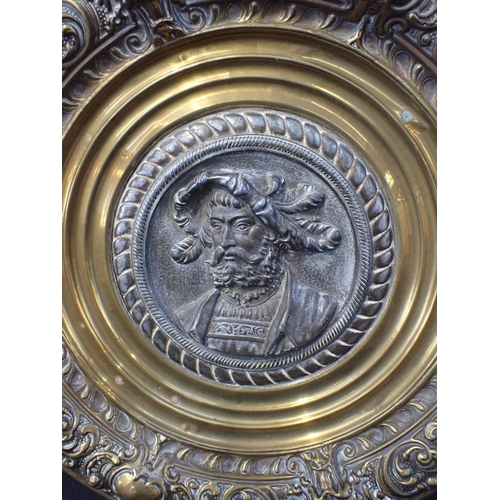 32 - A PAIR OF 19TH CENTURY RENAISSANCE REVIVAL PLAQUES the cast metal portrait centres in repousse brass... 