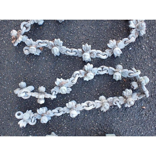 8 - A VICTORIAN ARCHITECTURAL CHAIN AND TWO STANCHIONS galvanised iron, the chain links of floral form, ... 