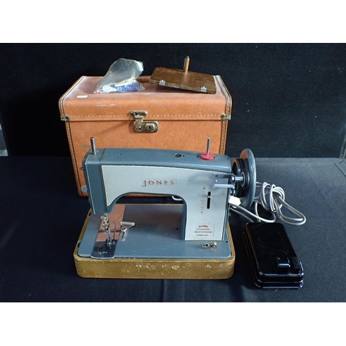 112 - A JONES ELECTRIC SEWING MACHINE with carrying case