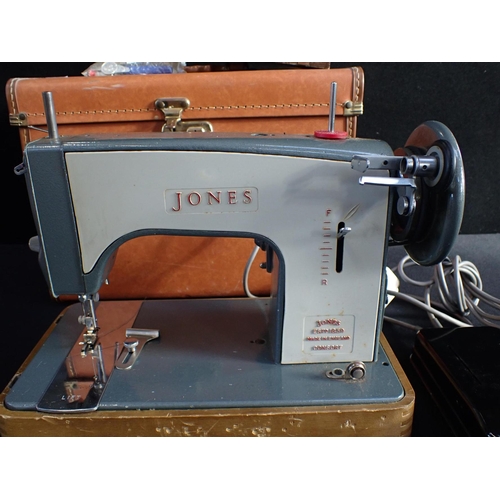 112 - A JONES ELECTRIC SEWING MACHINE with carrying case