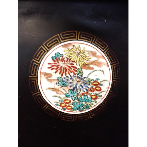 143 - A LARGE JAPANESE LACQUERED TRAY, EARLY 20th CENTURY mounted with three painted porcelain plaques 88 ... 