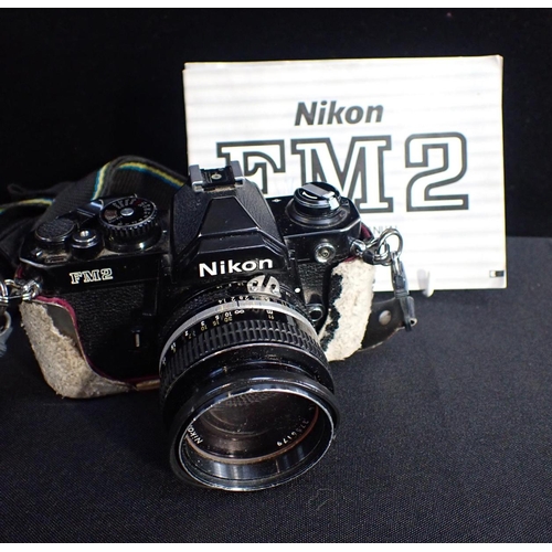 250 - A NIKON FM2 CAMERA, WITH NIKKOR 50mm 1:14 LENS and instructions (damaged cover), an Asahi Pentax K10... 