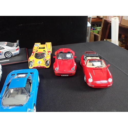 173 - A COLLECTION OF BURAGO AND OTHER 1/18 MODEL CARS racing cars and others, Mercedes, Bugatti, Porsche,... 