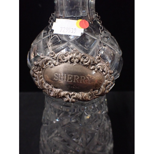 258 - AN EDINBURGH CRYSTAL STYLE THISTLE DECANTER with a silver sherry label, and a silver-mounted claret ... 