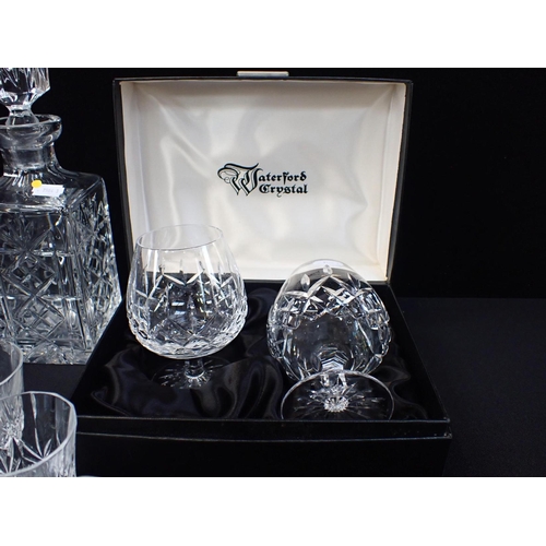 268 - A PAIR OF WATERFORD CRYSTAL LISMORE BRANDY BALLOONS boxed, a decanter and other table glass