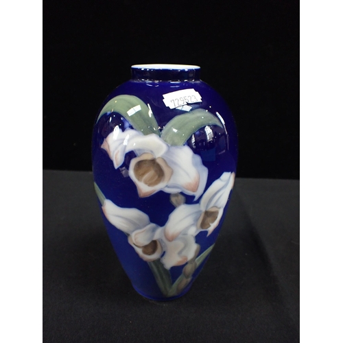 274 - A ROYAL COPENHAGEN PORCELAIN VASE decorated with irises on a blue ground, 18cm high