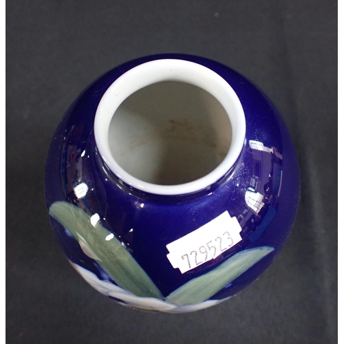 274 - A ROYAL COPENHAGEN PORCELAIN VASE decorated with irises on a blue ground, 18cm high