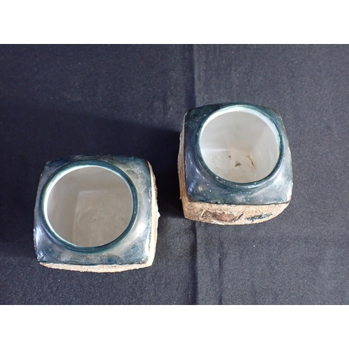 277 - TWO SIMILAR TROIKA VASES square form, 9 cms high, both signed LT