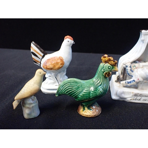 280 - A SMALL VICTORIAN CHICKEN FIGURE 8cm high, other bird figures, and a fairing; 'Returning at one o'cl... 