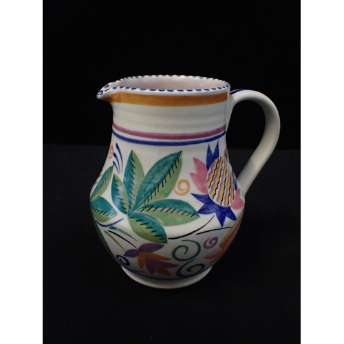 283 - TRUDA CARTER POOLE POTTERY a jug painted with MA pattern, impressed Poole England mark, 14 cms high