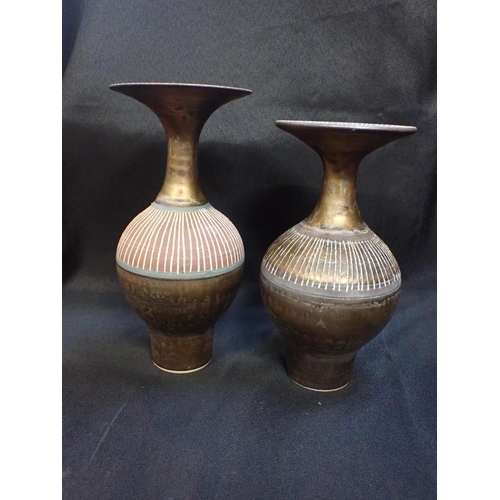 293a - TWO SIMILAR POTTERY VASES BY JEREMY BROADWAY with flared necks, and incised decoration, in the style... 