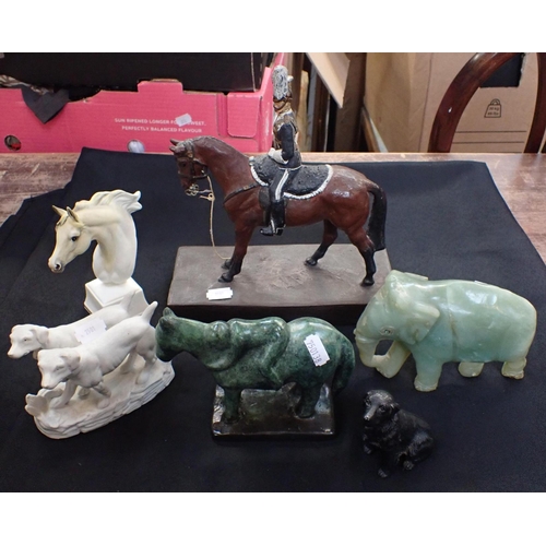 96 - A CAST METAL HORSE AND RIDER with other animal models, including a stone elephant and an equestrian ... 