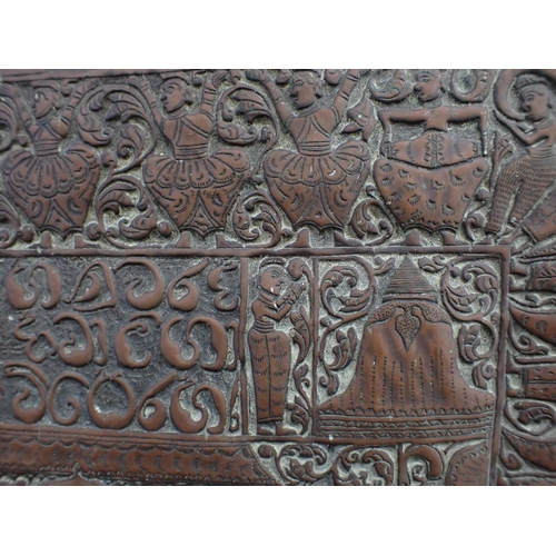 315 - AN INDO-PERSIAN REPOUSSE COPPER PANEL worked all over with figures, elephants, one with a howdah, sc... 