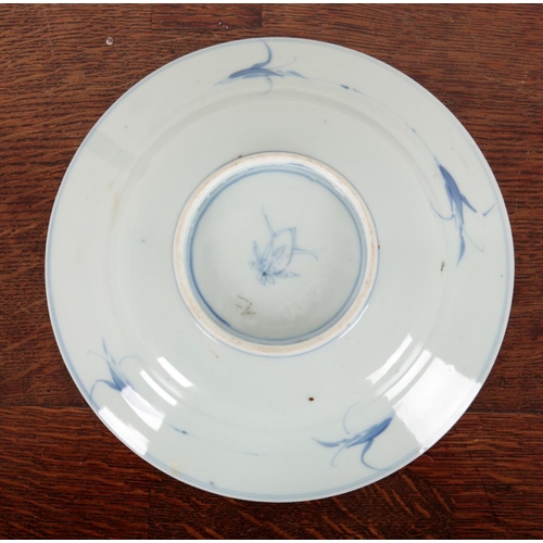 329 - TWO SIMILAR CHINESE BLUE AND WHITE PLATES Qing dynasty, the larger with flower mark to the base, the... 