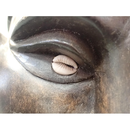 348 - A TRIBAL MASK; A BEARDED MAN with cowrie shell eyes 47cm high (woodworm damage)