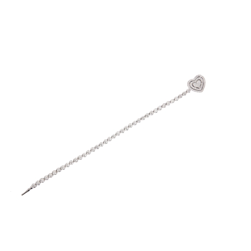 413 - DAMAS: A DIAMOND TENNIS BRACELET in 18ct white gold, set throughout with round brilliant cut diamond... 