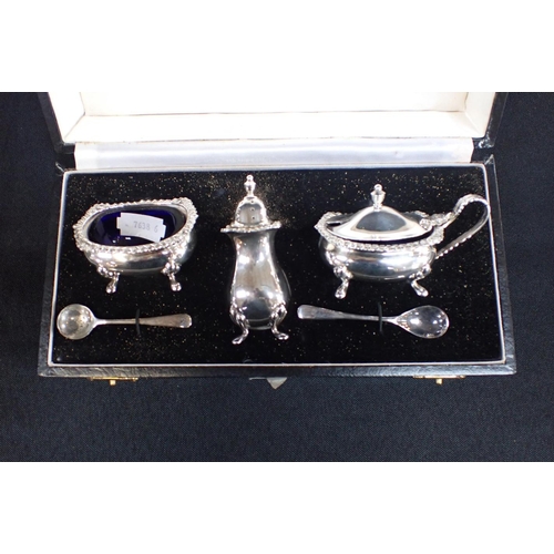 395 - A 'KUTCH' STYLE PAIR OF SALTS AND PEPPERETTES stamped 'Sterling silver', a marked silver cruet set, ... 