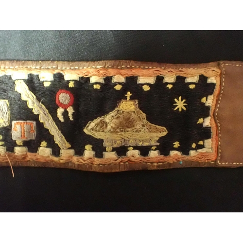 505 - A FIRST WORLD WAR EMBROIDERED BELT: 'INDIA' worked with motifs, flags of the Allies and date '1916' ... 