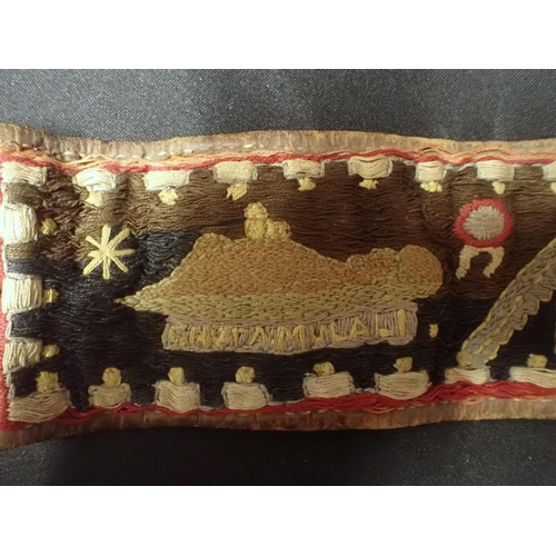 505 - A FIRST WORLD WAR EMBROIDERED BELT: 'INDIA' worked with motifs, flags of the Allies and date '1916' ... 