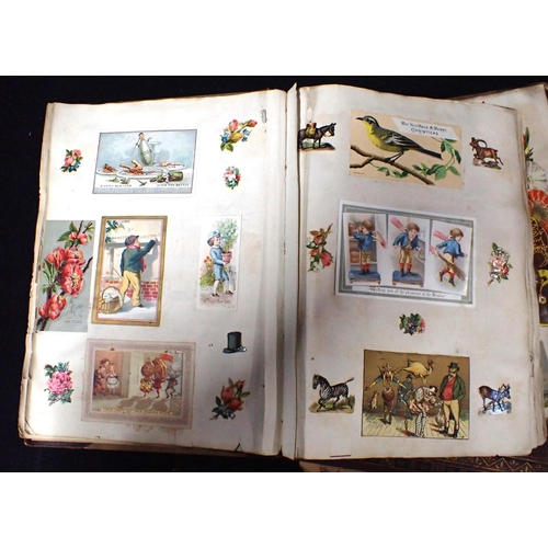 537 - TWO VICTORIAN SCRAP ALBUMS containing a variety of greetings cards with typically eccentric themes, ... 