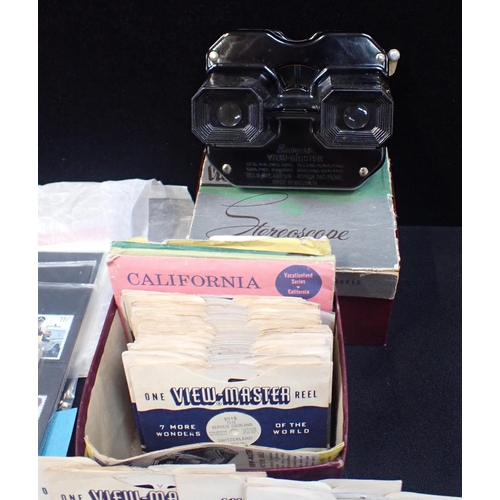 545 - A QUANTITY OF EPHEMERA Mint stamps, postcards, a Viewmaster and slides, and a Met 'Life in America' ... 