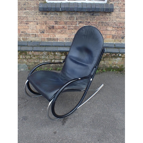 835 - A MODERNIST STEEL-FRAMED ROCKING CHAIR finished in chrome and black 57cm wide