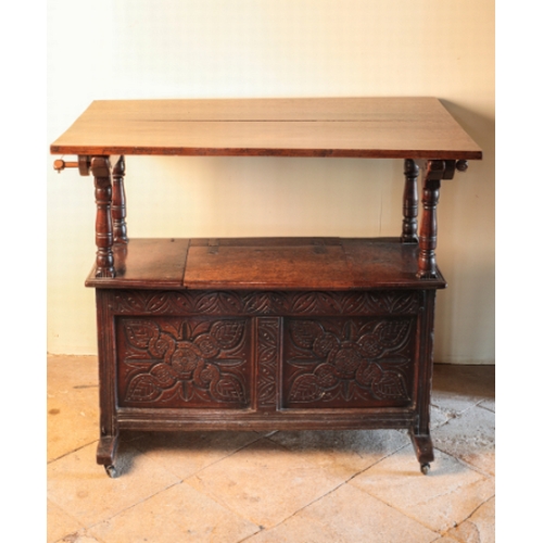 122 - A CHARLES II OAK BENCH TABLE

circa 1660 and later, with shaped arms on baluster supports over a rec... 