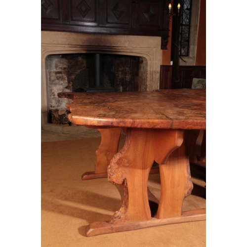 144 - A CONTEMPORARY BURR ELM DINING TABLE

by Tim Stead, designed as two trestle tables with thick burr e... 