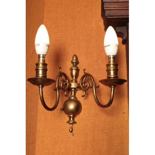 148 - A SET OF SIX GEORGE I STYLE BRASS WALL LIGHTS

each with two scrolling branches, fitted for electric... 