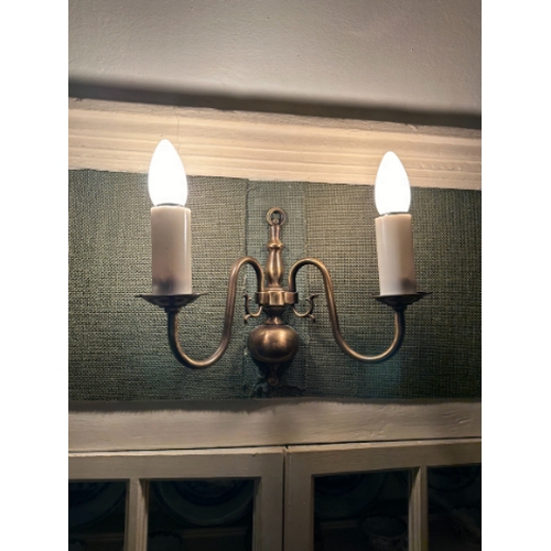 148 - A SET OF SIX GEORGE I STYLE BRASS WALL LIGHTS

each with two scrolling branches, fitted for electric... 