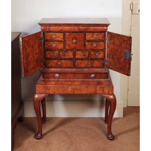 169 - A RARE GEORGE I ASH-VENEERED MINIATURE CABINET ON STAND

with ebony banding and stringing, the pair ... 