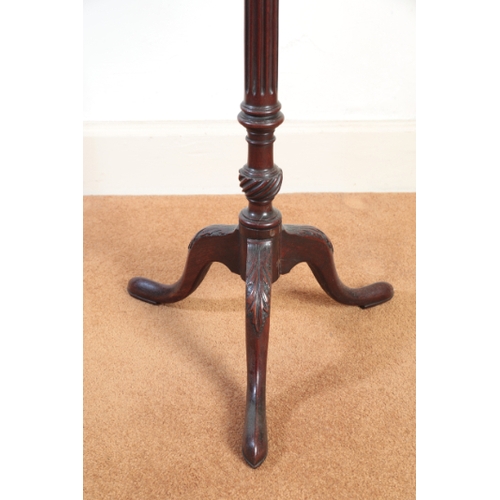 186 - A PAIR OF GEORGE III MAHOGANY TRIPOD TABLES

each with a rectangular top, on a fluted and gadrooned ... 