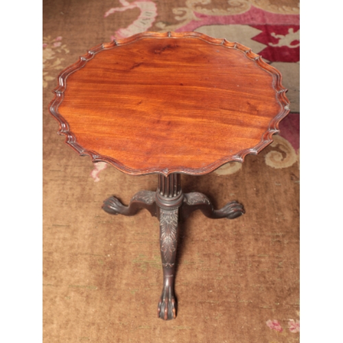 20 - AN IMPORTANT PAIR OF LATE GEORGE II MAHOGANY TRIPOD TABLES

the circular tip-up tops with a moulded ... 