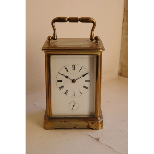 206 - A BRASS CASED CARRIAGE CLOCK

19th century, the enamel dial with Roman numerals, subsidiary second d... 