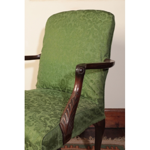 219 - A GEORGE II MAHOGANY ARMCHAIR

with a padded back and seat, the arms carved with acanthus leaves and... 