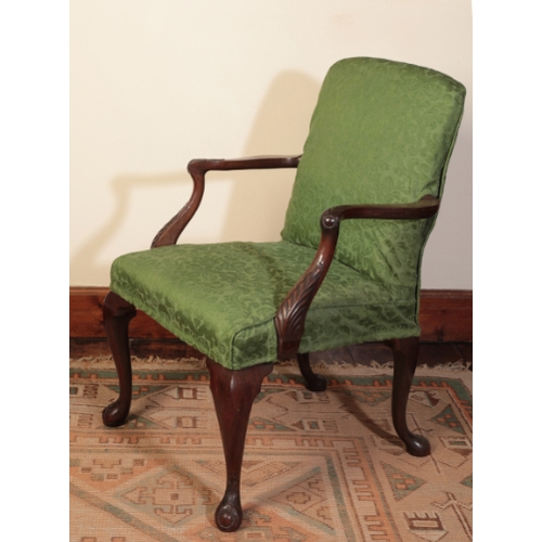 219 - A GEORGE II MAHOGANY ARMCHAIR

with a padded back and seat, the arms carved with acanthus leaves and... 