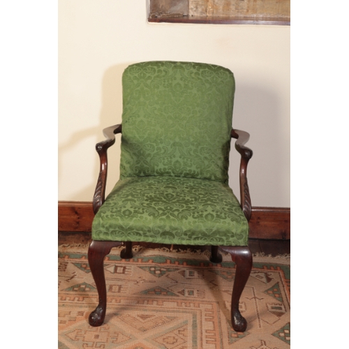 219 - A GEORGE II MAHOGANY ARMCHAIR

with a padded back and seat, the arms carved with acanthus leaves and... 