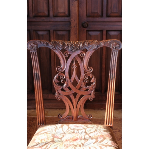 23 - A GEORGE II WALNUT CHAIR

in the manner of William Hallett, with an acanthus-carved top rail over a ... 