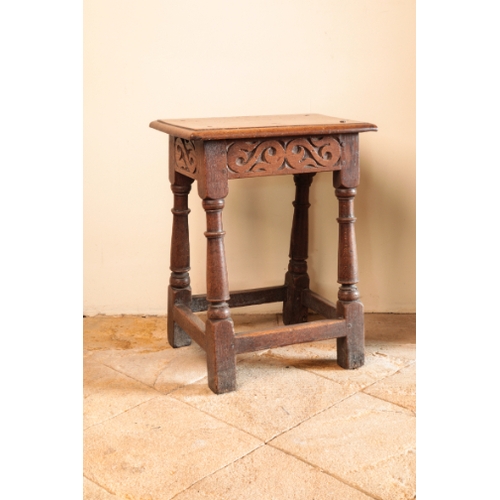 24 - A CHARLES II OAK JOINED STOOL

the rectangular seat with a moulded edge and secured by four pegs, ov... 