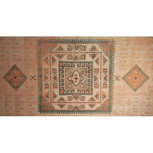 271 - A CAUCASIAN STYLE CARPET

with an ivory field centred by a square panel containing geometric motifs ... 