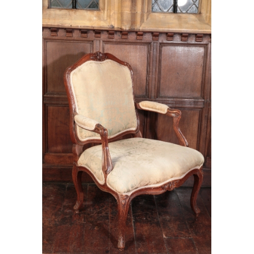 273 - A LOUIS XV BEECHWOOD FAUTEUIL

with a moulded frame carved with flowers and leafage, on cabriole leg... 