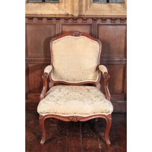 273 - A LOUIS XV BEECHWOOD FAUTEUIL

with a moulded frame carved with flowers and leafage, on cabriole leg... 