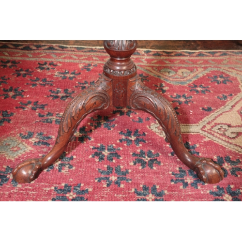 287 - A FINE GEORGE II MAHOGANY TRIPOD TABLE

the circular tip-up top with a baluster gallery, on a stop-f... 