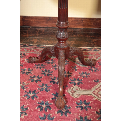 287 - A FINE GEORGE II MAHOGANY TRIPOD TABLE

the circular tip-up top with a baluster gallery, on a stop-f... 