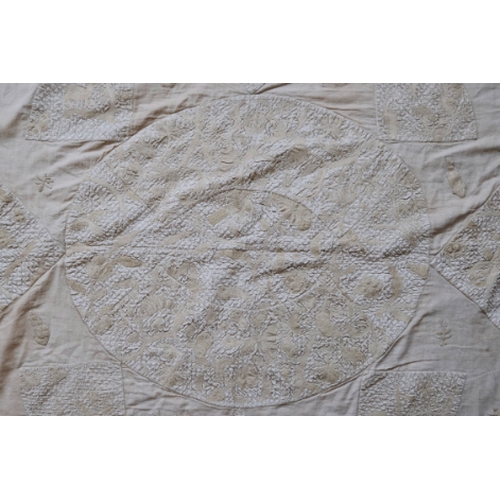 301 - A QUEEN ANNE CREAM SILK AND NEEDLEWORK BEDSPREAD

the central oval panel worked with flowering branc... 