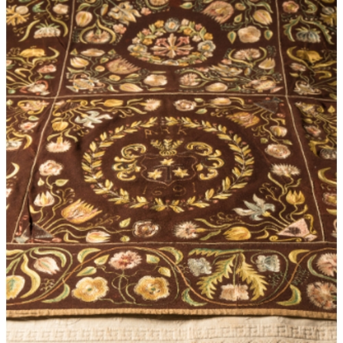 309 - A WILLIAM AND MARY NEEDLEWORK BEDSPREAD

decorated with flowers and leafy tendrils, on a brown wool ... 