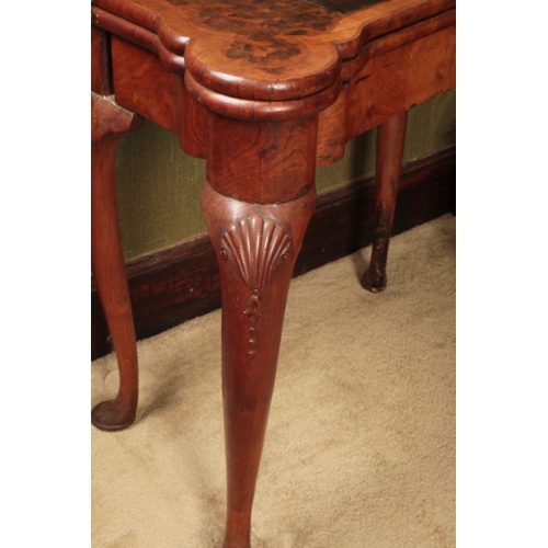 310 - A GEORGE I WALNUT TEA TABLE

the folding rectangular top with projecting ears for candles and with s... 