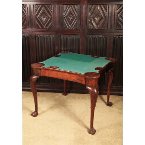 317 - A GEORGE I BURR WALNUT CARD TABLE

the folding rectangular top with projecting ears and crossbanding... 