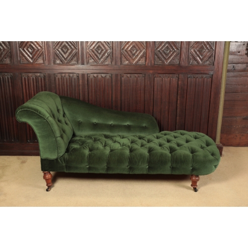 318 - A VICTORIAN CHAISE LONGUE

with buttoned green upholstery, on four turned walnut legs ending in cast... 